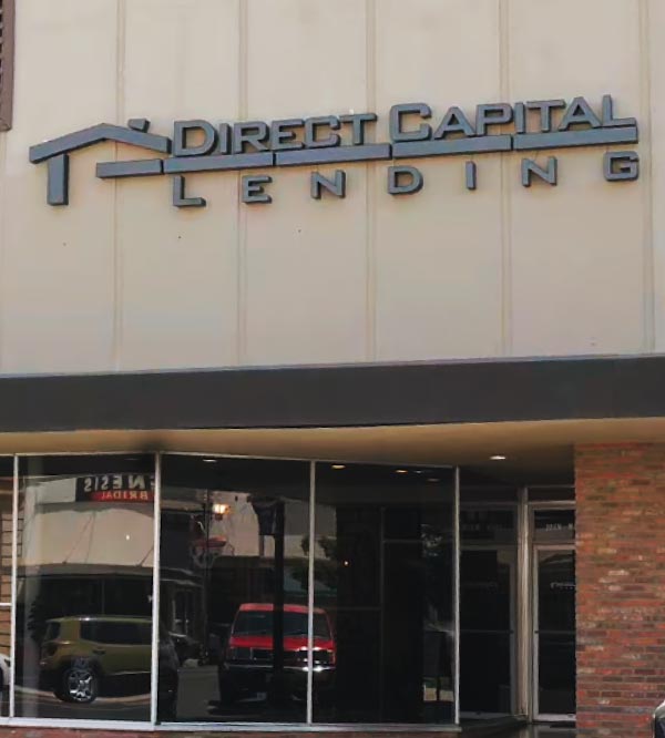 Exterior storefront of the Direct Capital Lending office in Porterville, California, featuring prominent building signage for a premier home loan and mortgage broker.