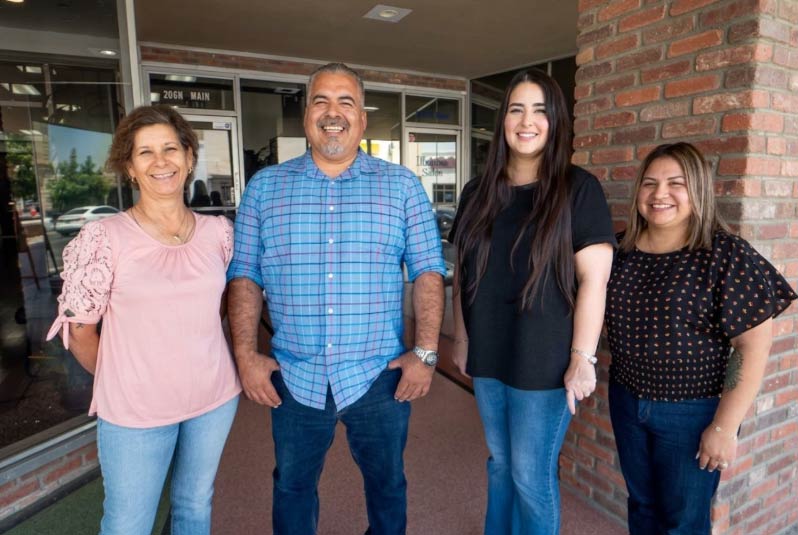 The friendly and professional mortgage specialist team at Direct Capital Lending standing outside their Porterville office, ready to assist clients with home loans in Tulare County.